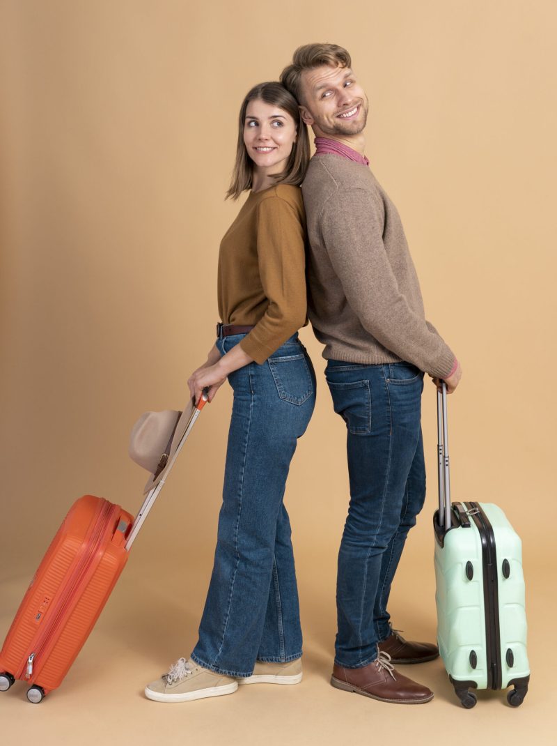 young-couple-getting-ready-traveling-with-luggage