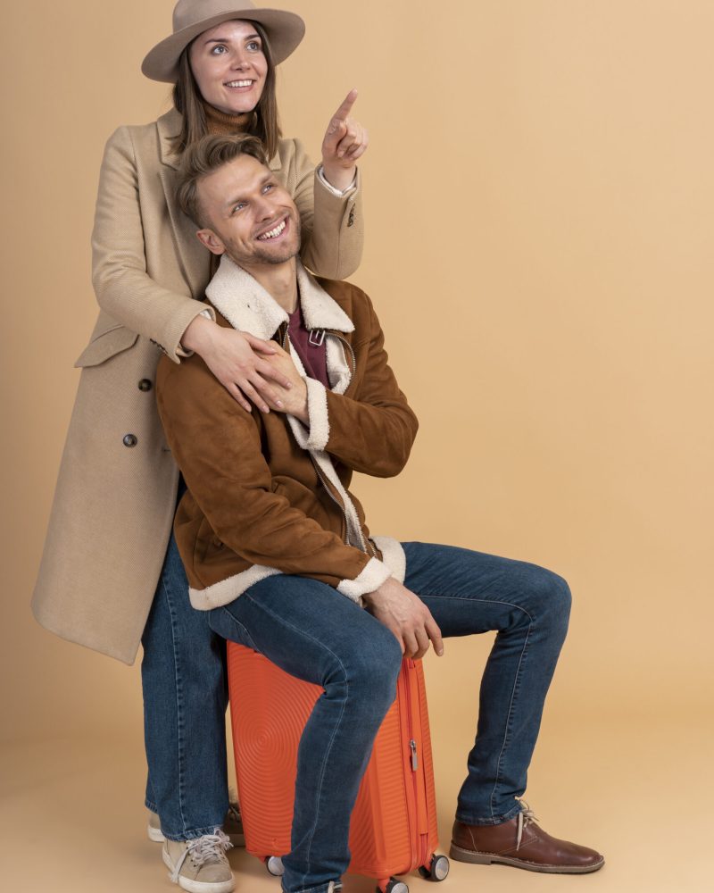 young-couple-posing-together-before-traveling